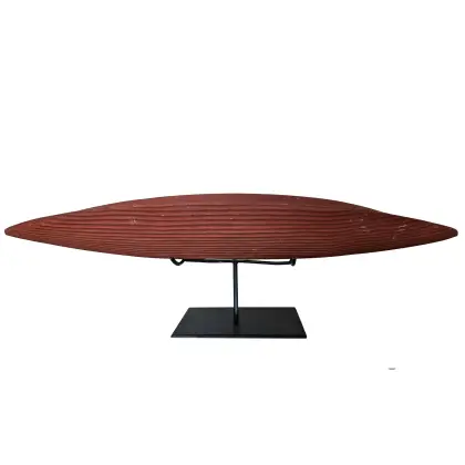 Artist Once Known, Coolamon with Ochre, c.1980, natural earth pigments on carved wood, 70 x 24 cm