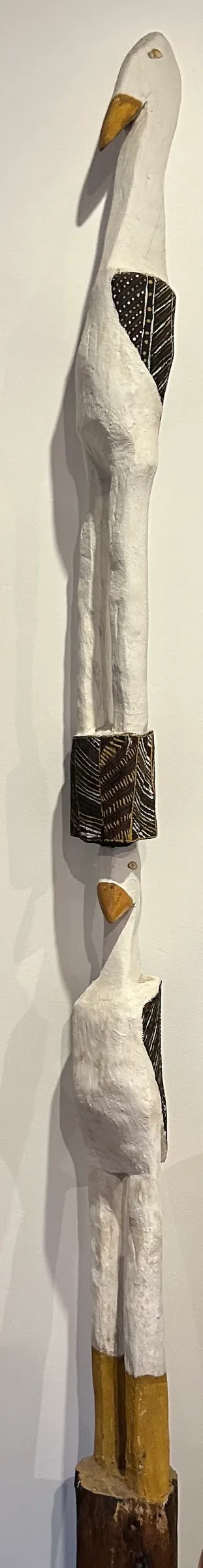 Guwaykuway Wanambi, Tokampini (Tiwi Double Bird Sculpture), natural earth pigments on carved wood, 240 x 15 x 15 cm