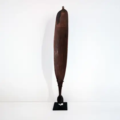 Artist Once Known, Central Australian Woomera, c. early 20th century, carved wood, 70h x 10w x 3d cm