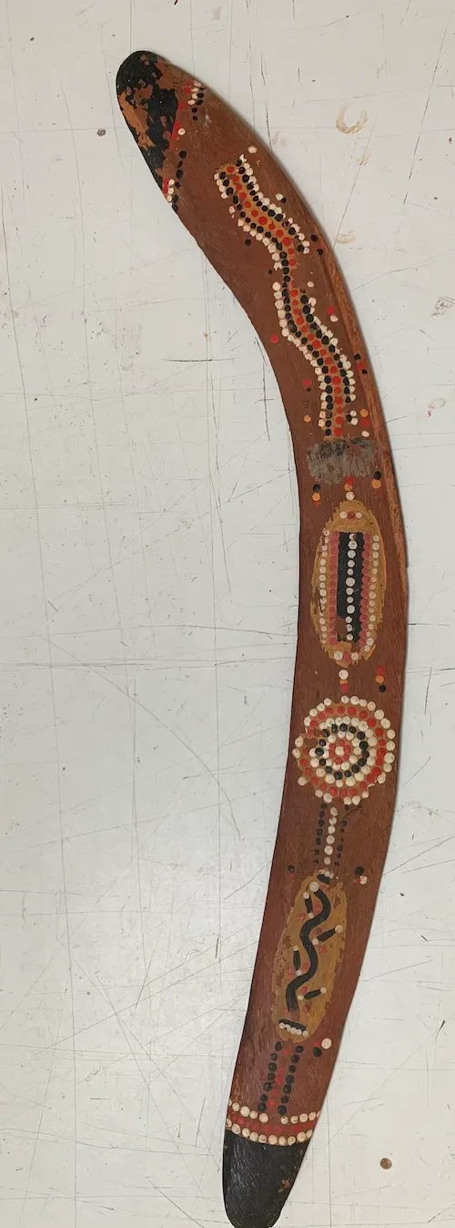 Artist Once Known, Central Desert Decorated Boomerang, 0.198, natural earth pigments on carved wood, 79 cm