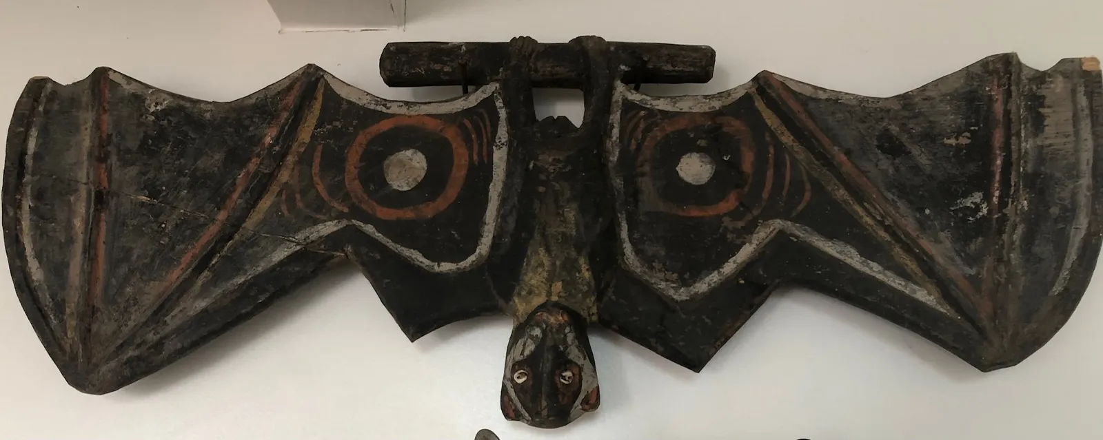 Artist Once Known, Bat, natural earth pigments on carved wood