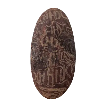Artist Once Known, Shield engraved with designs, carved wood, 66 x 32 cm