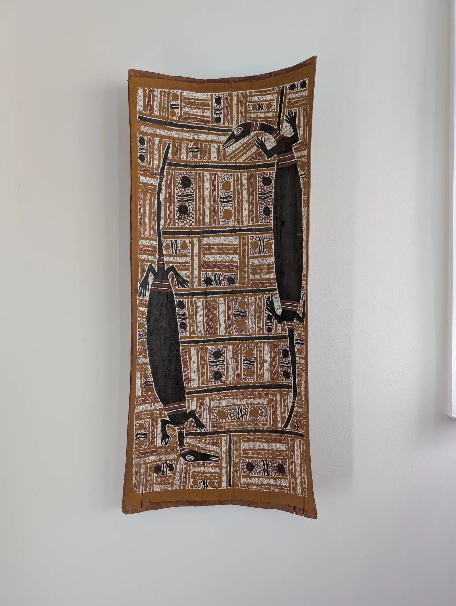 Wandjuk Marika, Djanda, Sacred Goannas of the Djan'kawu, c.1970, natural earth pigments on bark, 90 x 39 cm