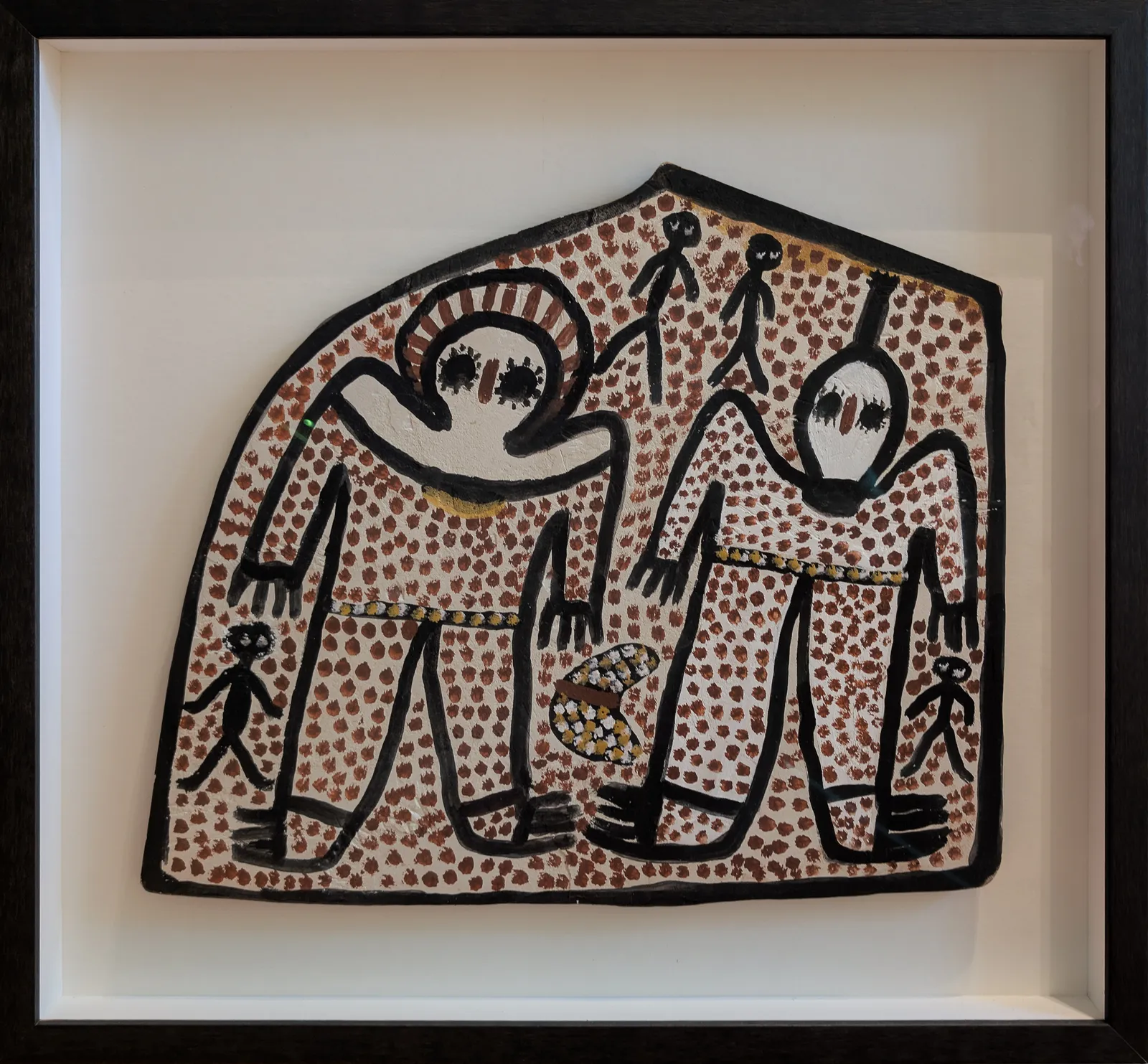 Lily Karadada, Wandjinas, 1989, natural earth pigments on slate, 36 x 42 cm (irregular); 51 x 56 cm frame