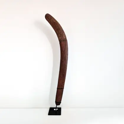 Artist Once Known, Central Desert Hunting Boomerang, c.1920, natural earth pigments on carved wood, 73 x 7 cm