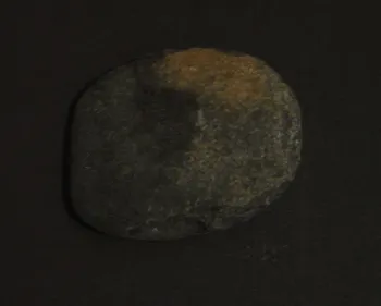 Artist Once Known, Early Grinding Stone, stone, 14 x 12 x 3 cm