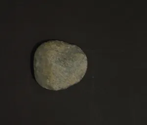 Artist Once Known, Early Grinding Stone, stone, 12 x 10 x 3 cm