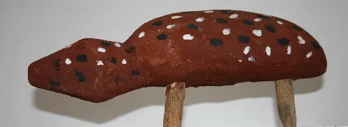 Lena Yarinkura, Spotted quoll, natural earth pigments on wood, 36 x 12 cm