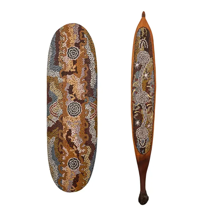 Clifford Possum Tjapaltjarri, Women's Ceremony (shield) and Possum Trail at Napperby (woomera), 1992, synthetic polymer paint on bean wood, 65 x 20 cm (shield); 86 x 11 cm (woomera)